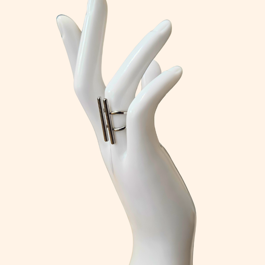 Elegant accessory by Roots Jewellery: The Silver Open Ring features two parallel bar designs on top, set against a sleek stainless steel background.
