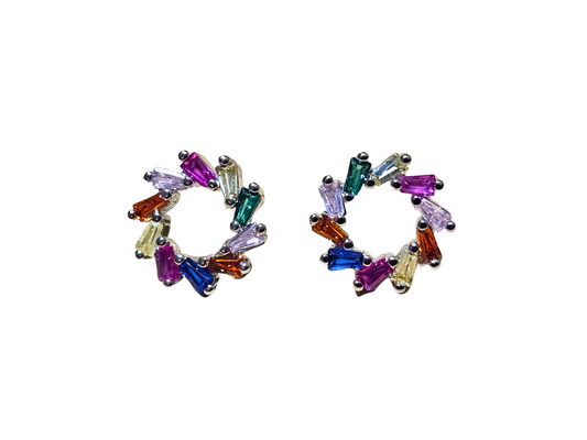 A pair of stud earrings from Roots Jewellery, featuring multicolour cubic zirconia stones artistically arranged in a spiral on a beige background.