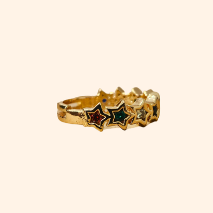 The Rainbow Stars Gold Ring from Roots Jewellery captivates with its star pattern, each embellished with shimmering gemstones. Its simple background is elevated by rhodium plating, providing a sleek finish. The adjustable design guarantees a perfect fit for any occasion.