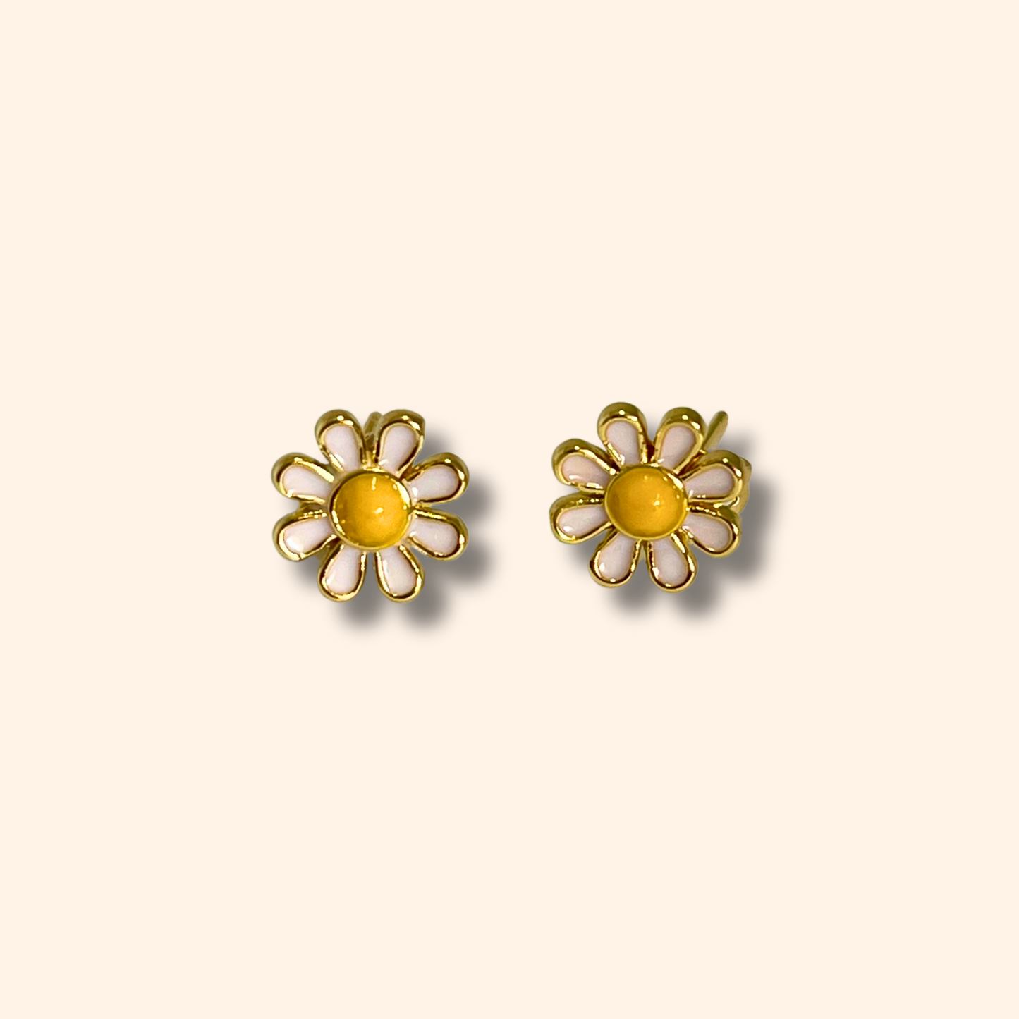 Daisy Flower Gold Earrings by Roots Jewellery featuring yellow centers displayed on a light background.