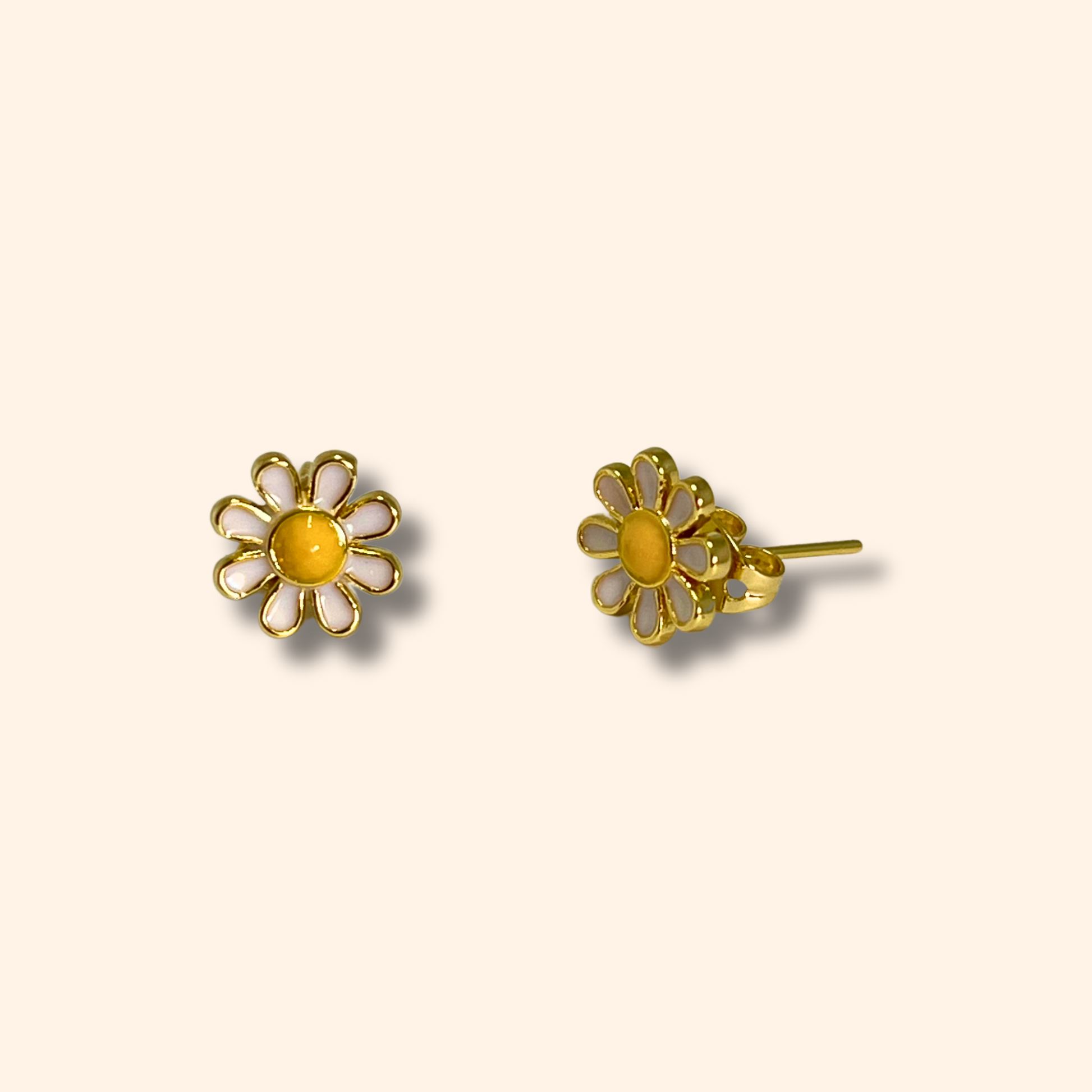 Daisy Flower Gold Earrings by Roots Jewellery featuring yellow centers displayed on a light background.