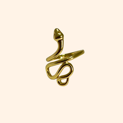 Explore the captivating Snake Gold Ring by Roots Jewellery, elegantly crafted with an adjustable design to ensure a perfect fit. This striking statement piece, set against a plain background, highlights its intricate serpent form and luxurious golden sheen.