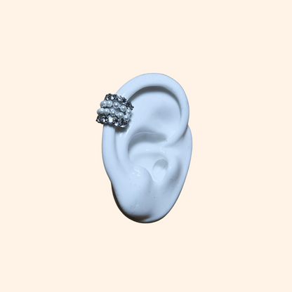 Introducing the Luxe Pearl & Zircon Stainless Steel Ear Cuff by Roots Jewellery, showcasing sleek rows of lustrous white pearls and glistening zircons set against a polished backdrop.