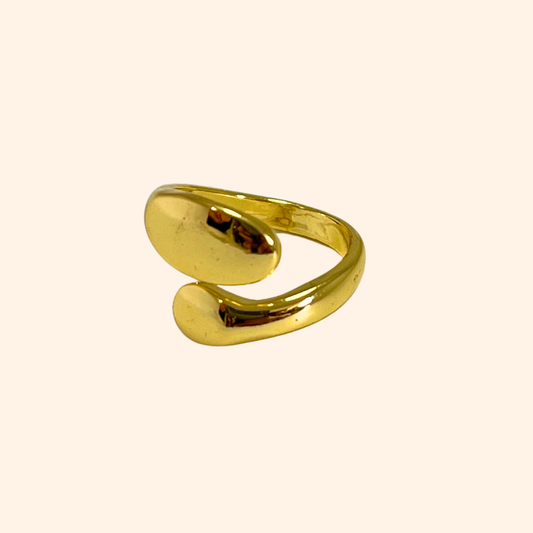 Discover the Double Twist Gold Ring by Roots Jewellery, showcasing a gold open-ended design with smooth, curved elegance on a light background. This exquisite piece ensures a perfect fit every time with its adjustable sizing feature.