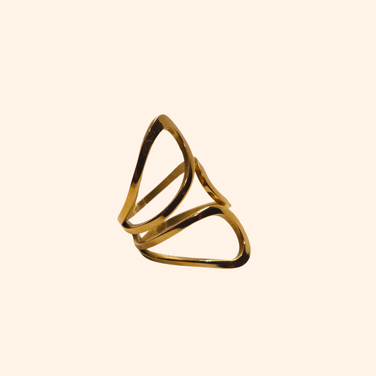 The Golden Petals Ring by Roots Jewellery embodies modern elegance with its geometric, open design set against a light background, making it a truly unique piece of jewellery.