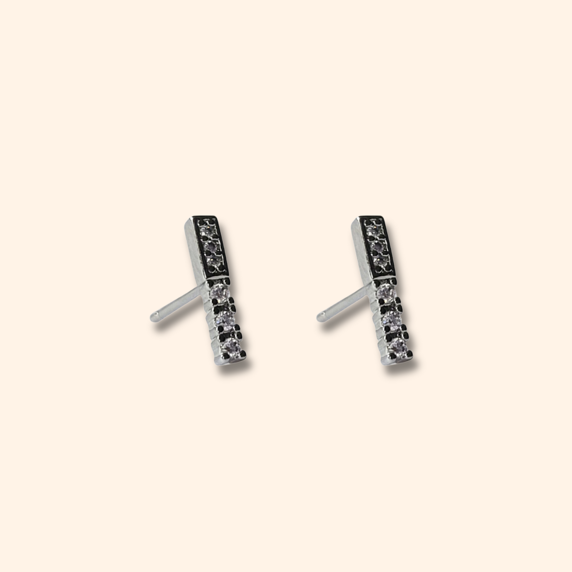 Elegant rectangular stud earrings from Roots Jewellery, showcasing a chic design with black and clear stones elegantly set against a light background. These silver earrings are the perfect stylish accessories.