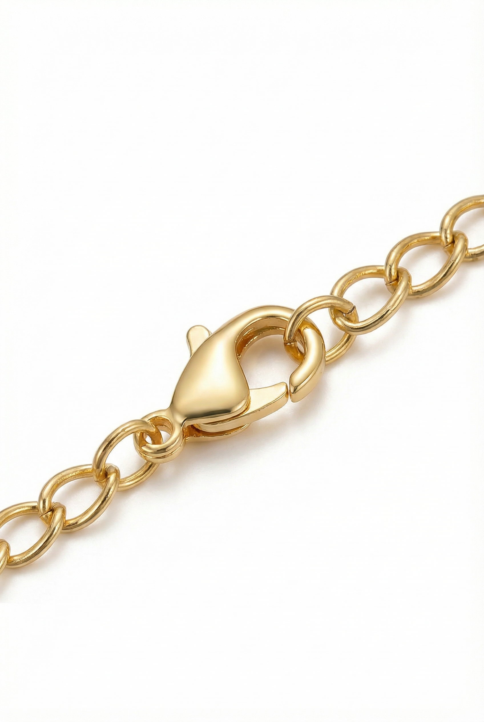Gold chain bracelet with clasp on a white background